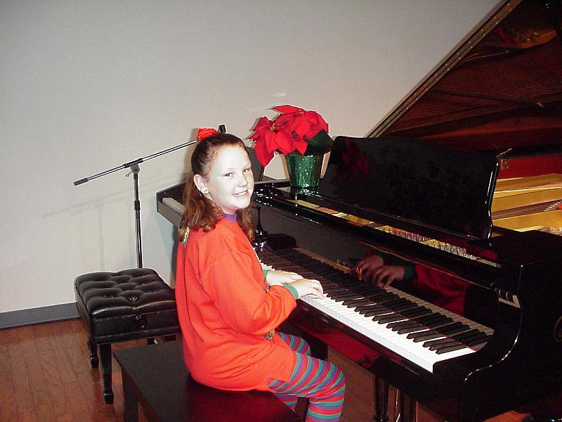 Stephanie Williams sitting at the piano at her Dec 4, 1999 piano recitial 3.jpg - 1999 - Piano Recital - Stephanie